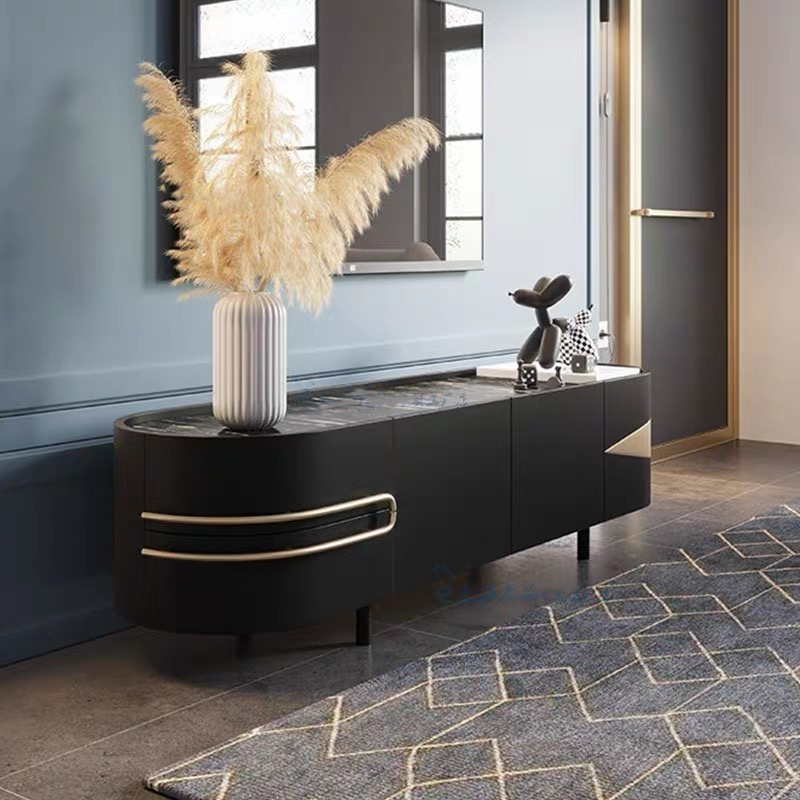 Luxury curved edge TV cabinet showcasing sintered stone top and gold trim from the front angle.