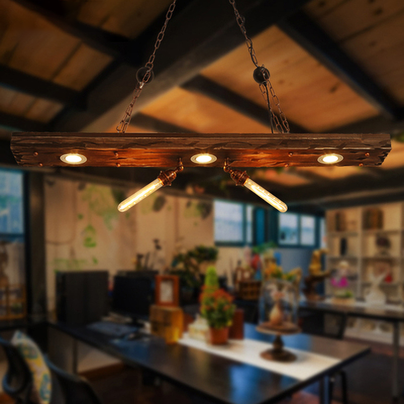 Close-up of the Heritage Glow wood pendant light highlighting its Edison bulb and industrial lighting finish