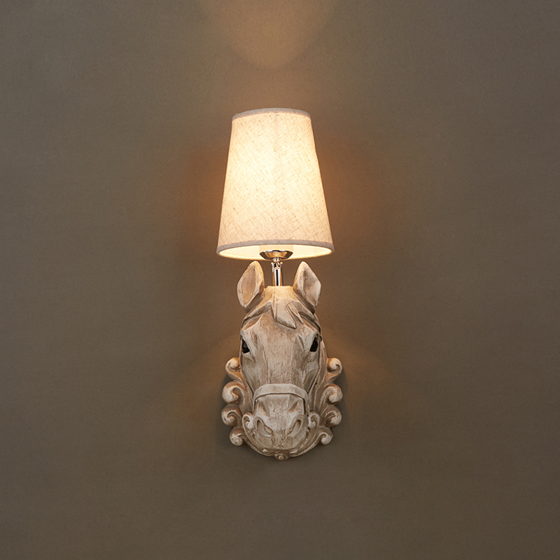 Industrial style Rustic Horse Resin Wall Lamp placed above a stylish dining area, enhancing the decor.