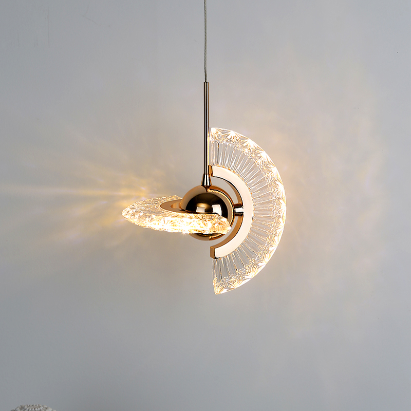 Elegant gold pendant light with clear glass shade, perfect for dining room decor.