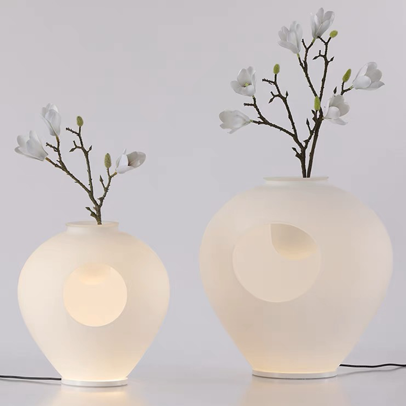 LumaBloom table lamp placed in a hotel room with minimalist decor