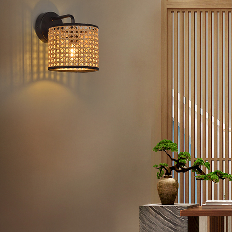 Close-up of the handmade woven drum rattan wall light, highlighting its intricate craftsmanship.