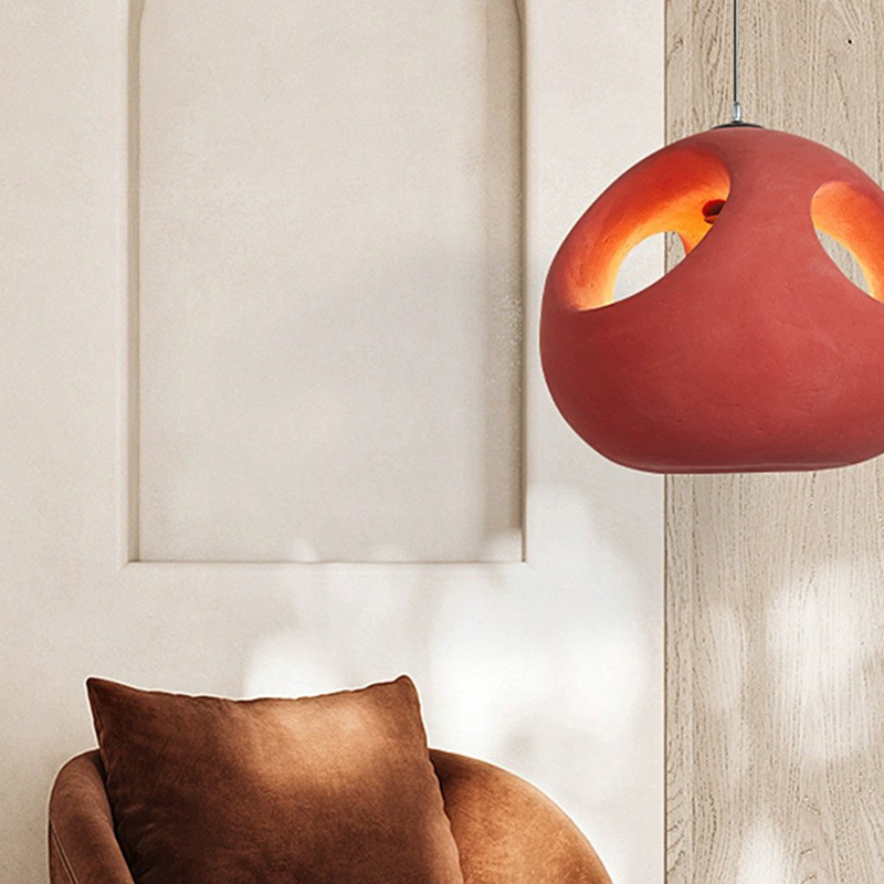 Close-up of the Nordic pendant light illuminating a cozy living room setting.