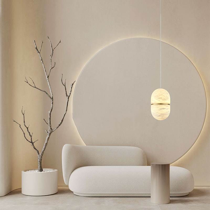 Close-up of the marble pendant light illuminating a cozy bedroom, highlighting its soft glow.