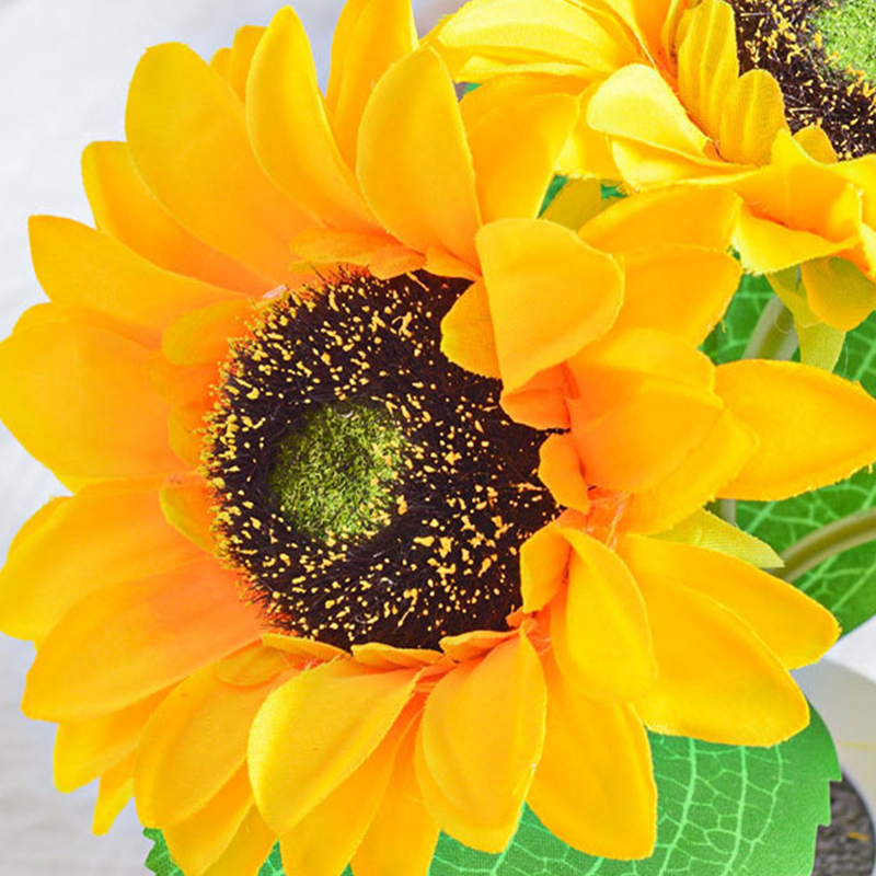 Charming sunflower lamp placed on a bedside table, creating a cozy atmosphere.