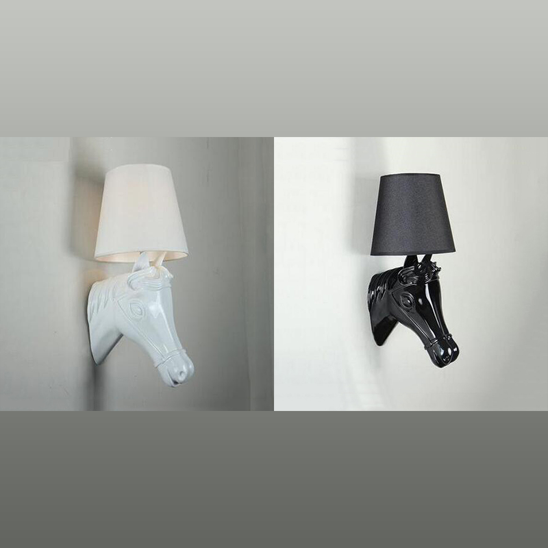 Side view of resin horse wall lamp mounted in a hallway setting