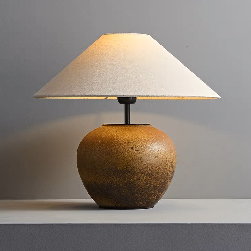 Front view of the Japanese luxury handmade pottery table lamp showcasing its elegant fabric lampshade.