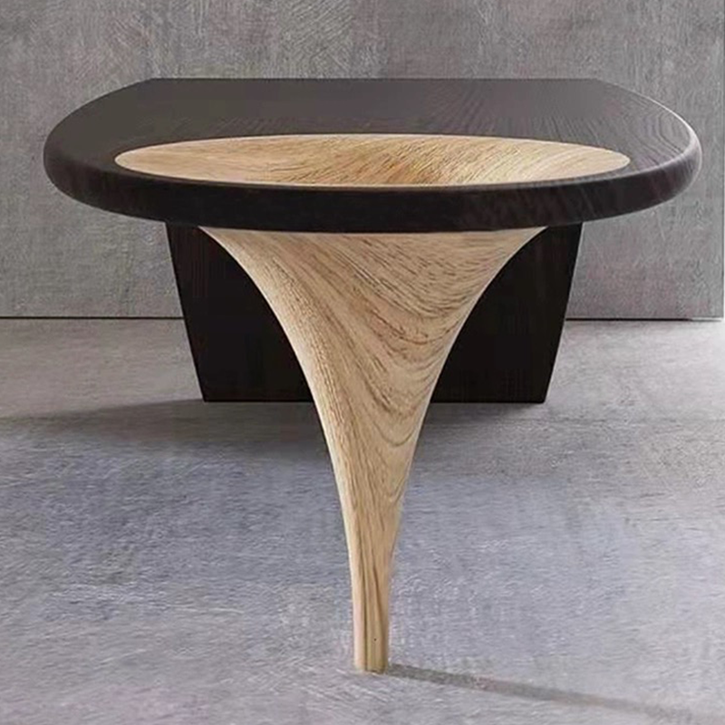 Front-facing view of solid wood desk in black, showing minimalist frame and natural wood texture