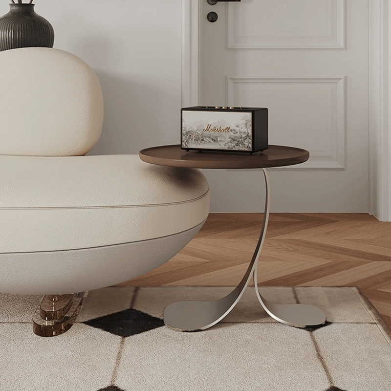 Top-down shot showing compact size of side table next to plush armchair—best side table for small living room setups