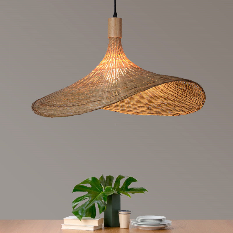 Bamboo pendant light hanging over a dining table, creating an inviting atmosphere.