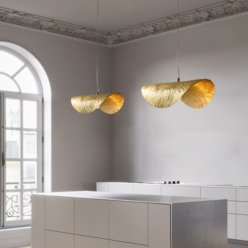 Elegant copper pendant light showcasing a lotus leaf design from an angle, perfect for dining rooms.