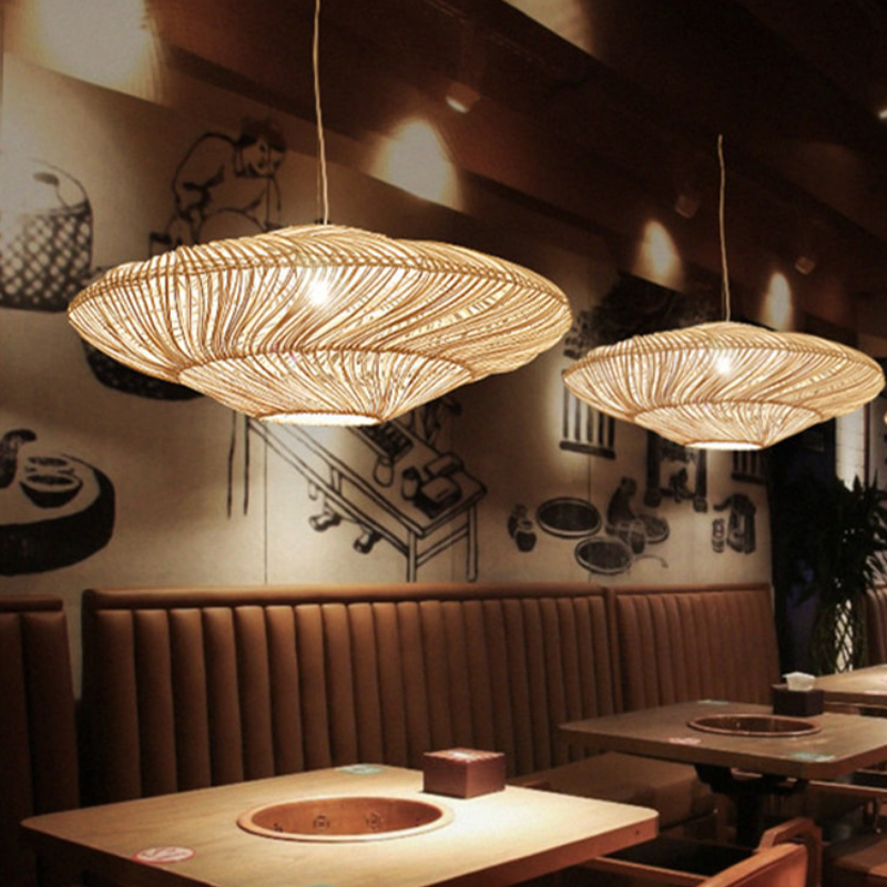 Rattan pendant light illuminating a cozy dining room, highlighting its warm glow.