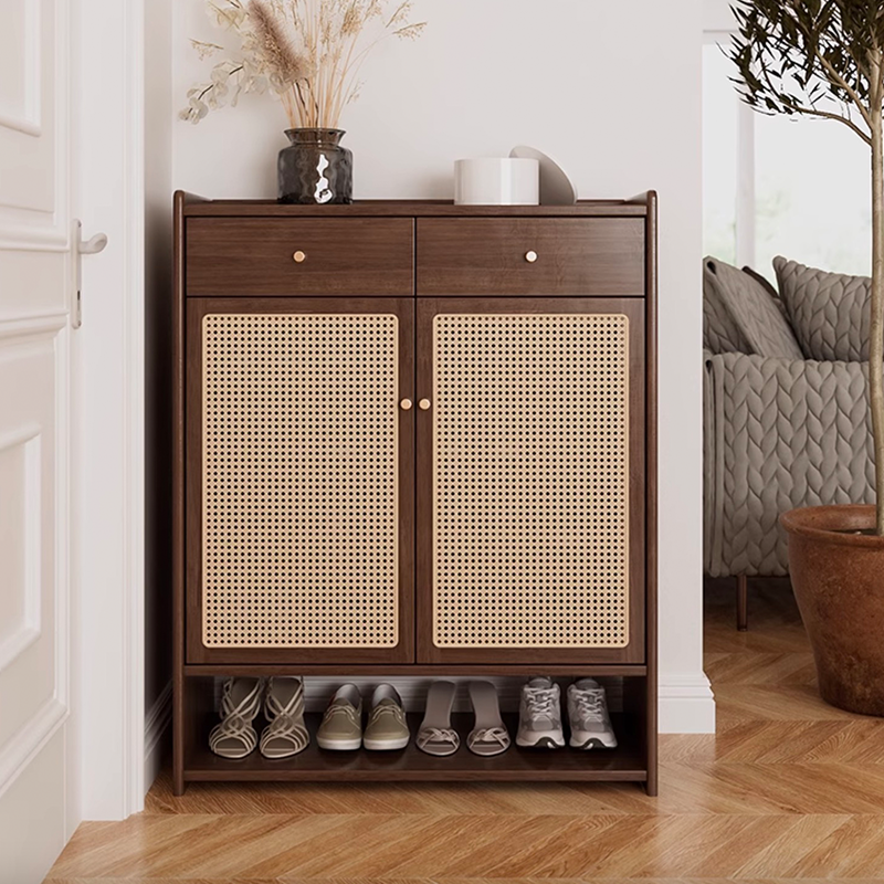Angled front view showing natural wood finish and dual rattan doors on shoe cabinet