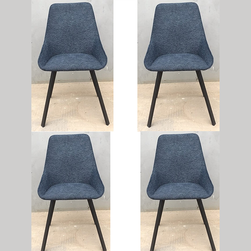 Close-up of the ergonomic backrest of a blue upholstered chair, showcasing its soft and inviting design.