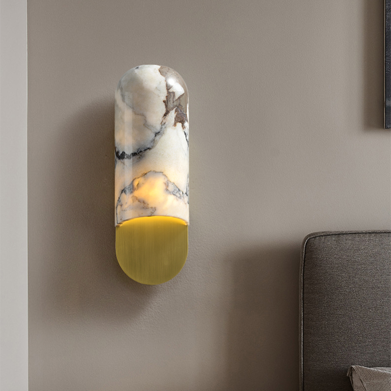 The Elegant Copper Marble LED Wall Sconce illuminating a cozy study area.