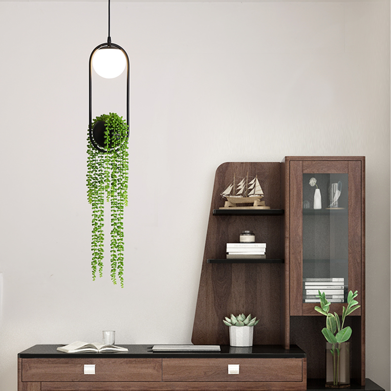 Close-up angle of the LED pendant light with adjustable ropes and potted plants.