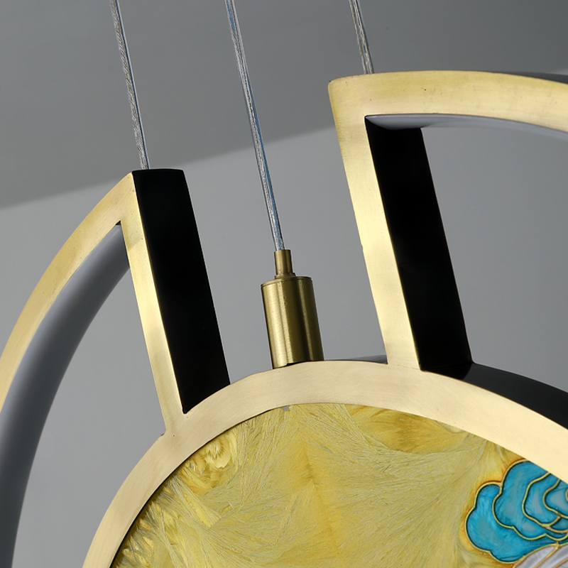 Close-up of the stained glass light illuminating a cozy living room setting.