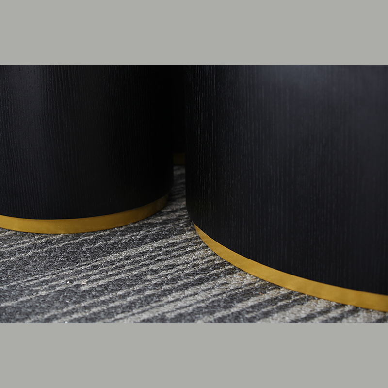 Elegant 23.5" round coffee table with gold base, styled in a modern living room.