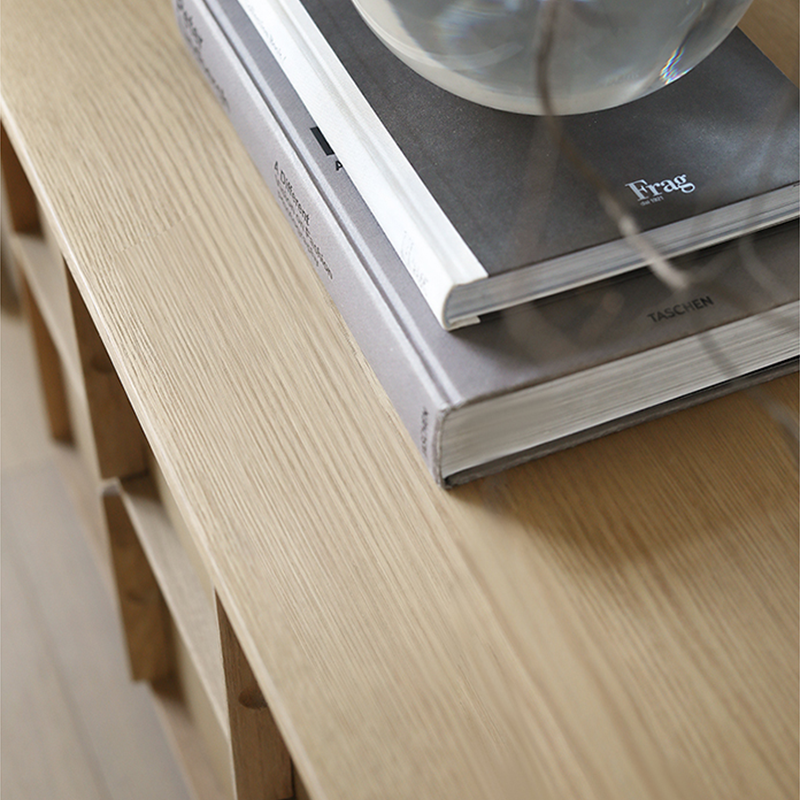 Front view of the elegant solid oak TV stand showcasing six drawers and cable management features.