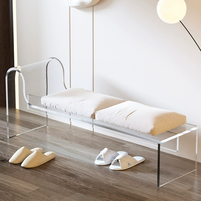 A chic white acrylic entryway bench in a modern hallway setting.