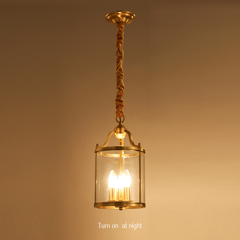 Elegant European crystal pendant light showing three bulbs and clear glass shades from the side.