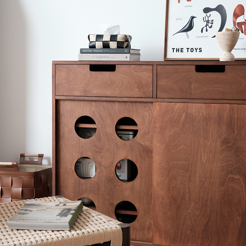 Close-up of the cabinets birchwood finish and hardware details, emphasizing quality craftsmanship.