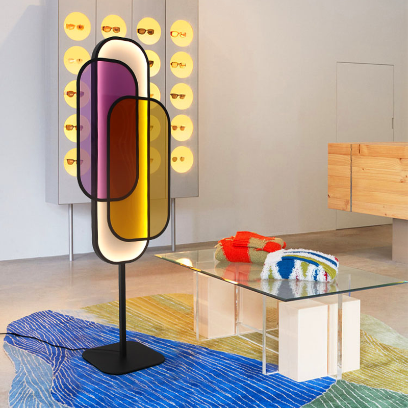 ChromaGlow floor lamp illuminating a cozy bedroom with multicolor LED lights.