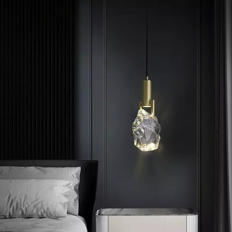 Elegant crystal pendant light showcasing its unique design from a side angle.