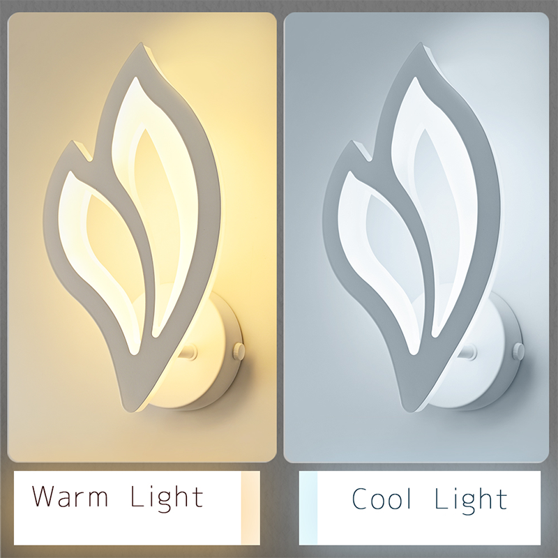 Elegant white leaf LED wall sconce showcased in a cozy cafe setting.