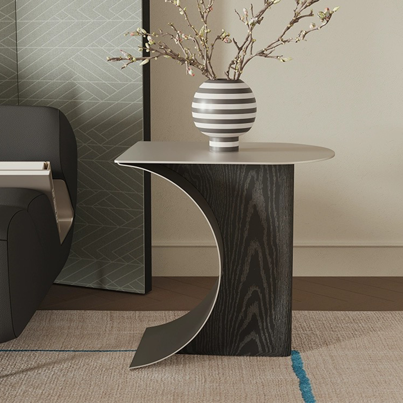 Chic Crescent Moon Coffee Table showcasing the elegant design from a side angle in a modern living room setting.