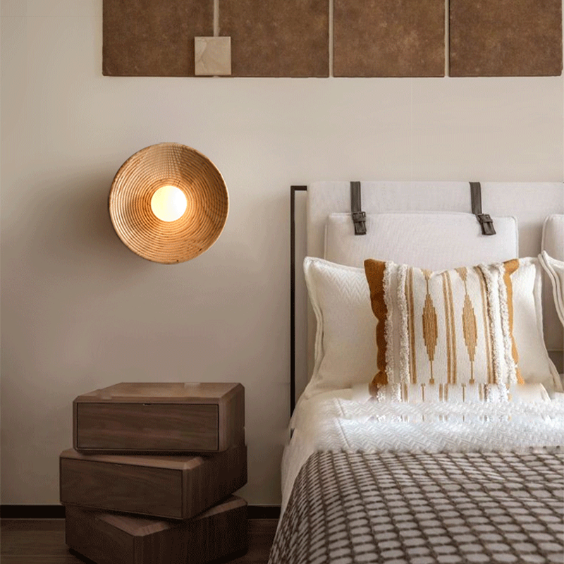 Japanese Retro Handmade Wooden Shell Wall Lamp from a side angle in a cozy living room setting.