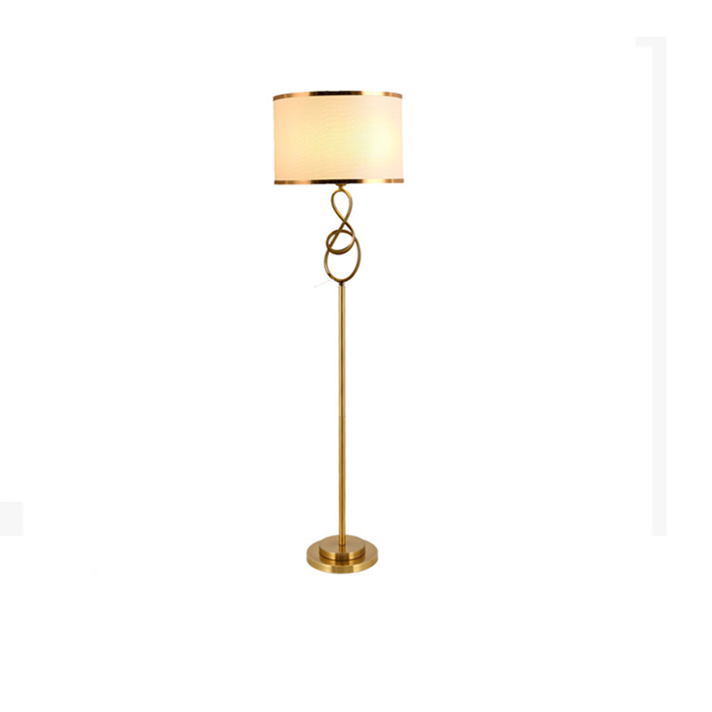 The tall Elegant Gold LED Floor Lamp elegantly illuminating a modern bedroom with warm light.