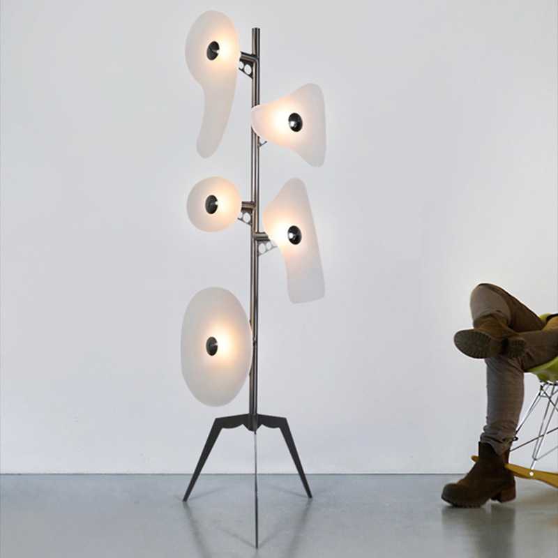 Close-up of the tripod base of the Elegant Orbital Floor Lamp, emphasizing its stylish design and craftsmanship.