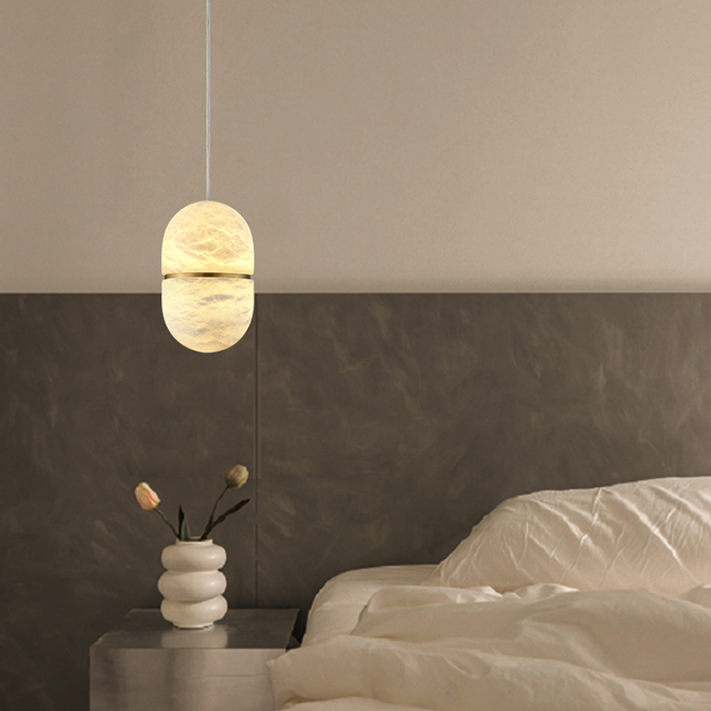 View of the pendant light installed in a modern hotel room, demonstrating its upscale appeal.
