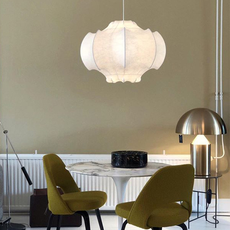 A dining room featuring the Nordic LED pendant light, creating a warm and inviting atmosphere.