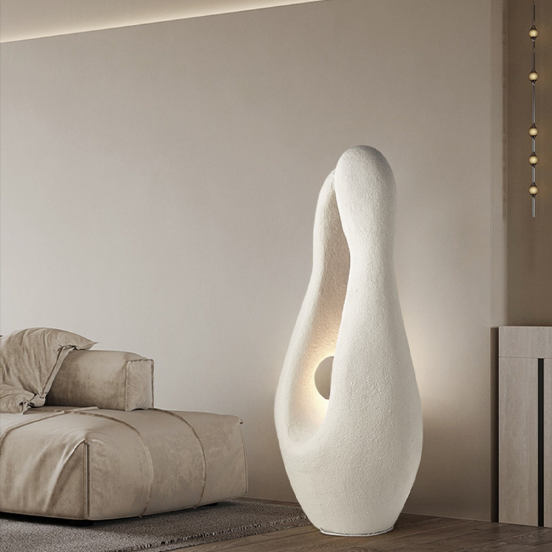 Elegant ambient lighting floor lamp positioned in a stylish foyer, creating a warm atmosphere.