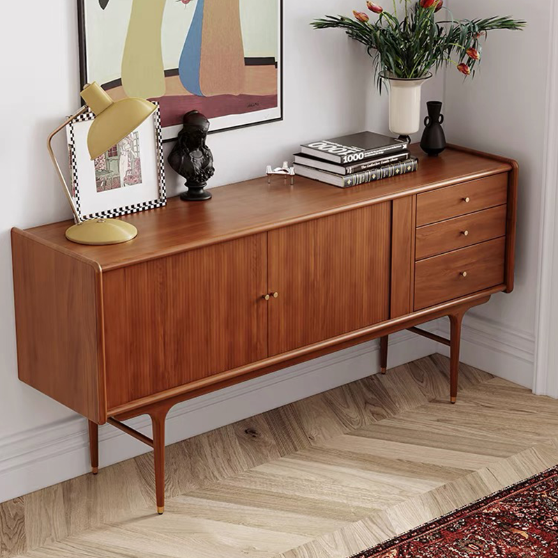 Side view of the wooden cabinet highlighting the unique brass knobs and solid wood construction.