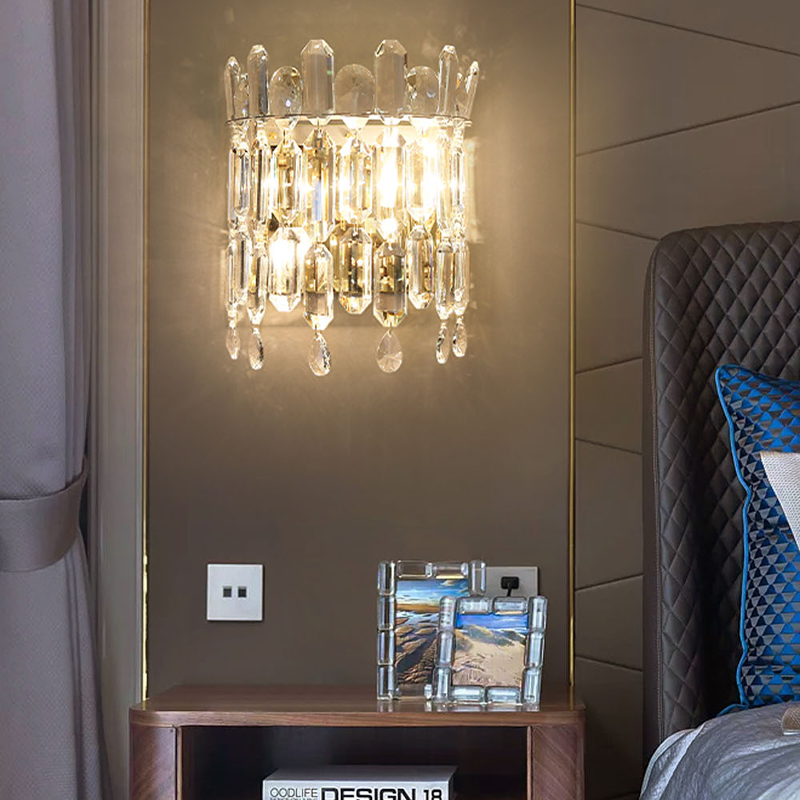 Close-up of the crystal shade on the luxury gold wall lamp, highlighting its intricate details.