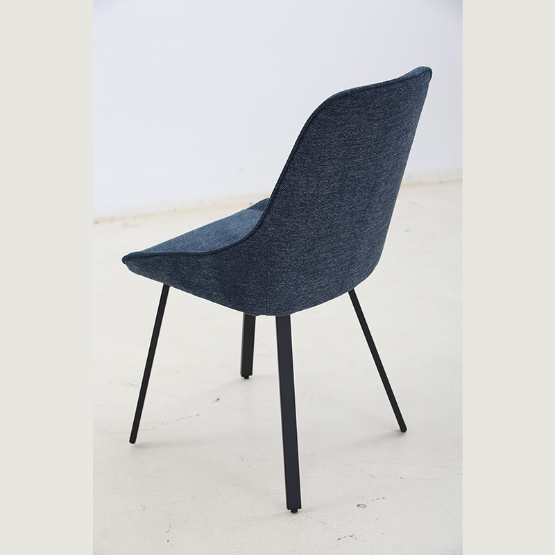 Stylish blue upholstered dining chair with a comfortable cushion and metal legs, ideal for modern dining spaces.