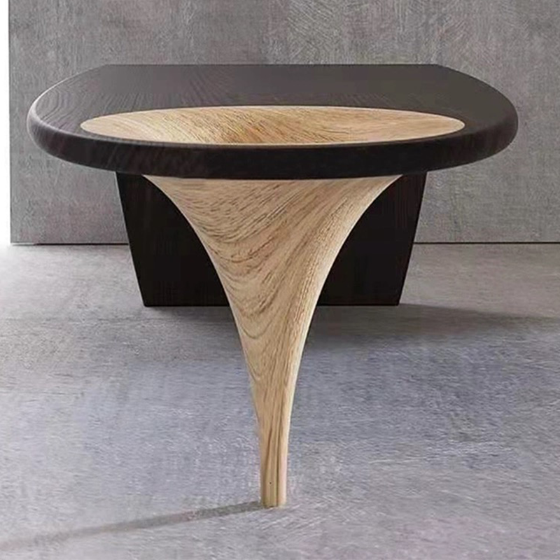 Close-up of writing desk corner detail, highlighting oil finish and matte black lacquer