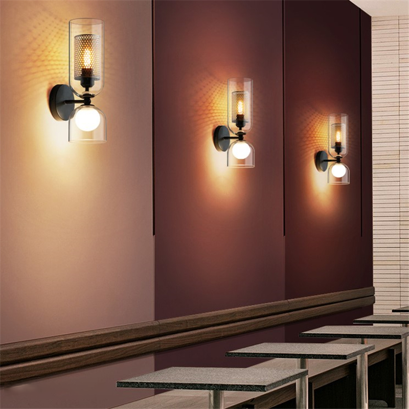 Side view of modern lighting wall sconce casting warm glow on hallway wall decor.