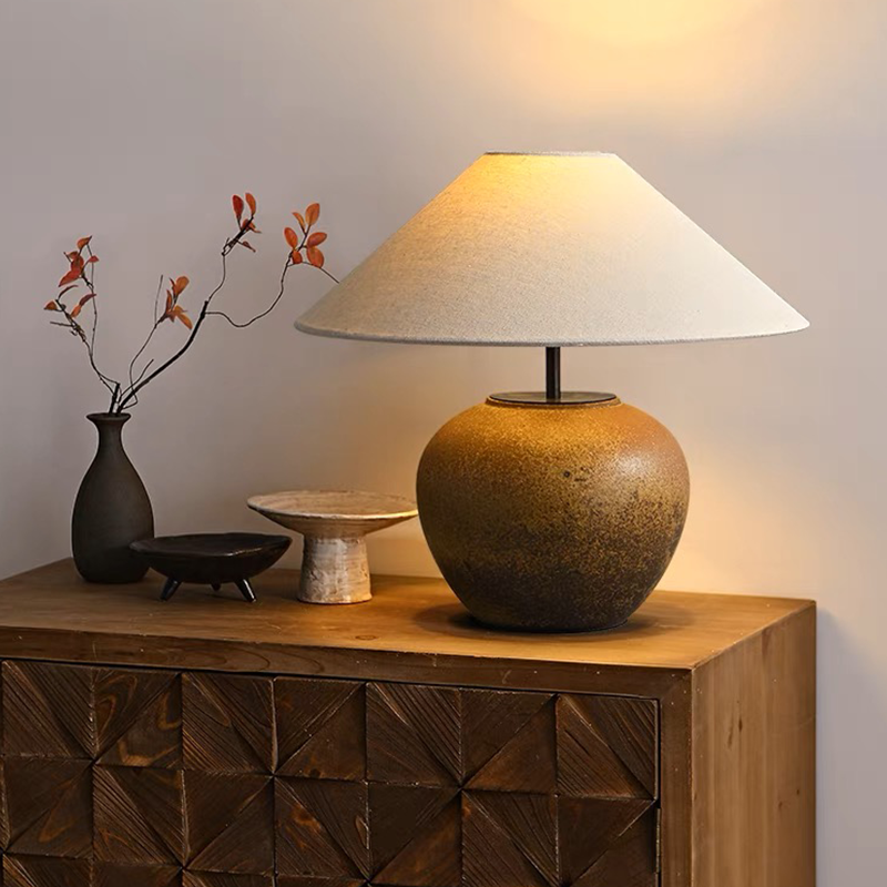 Front view of the Japanese luxury handmade pottery table lamp showcasing its elegant fabric lampshade.