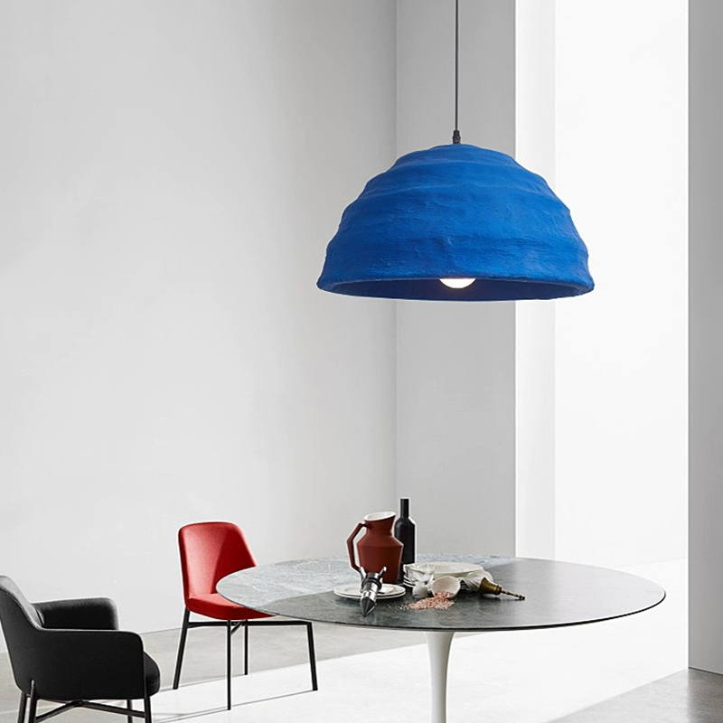 Klein Blue Dome Pendant Light illuminating a modern living room