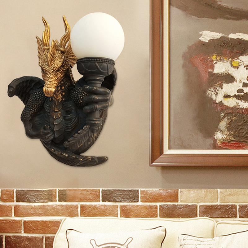 The Retro Dragon Resin Wall Lamp in a cozy living room setting, providing warm LED lighting.