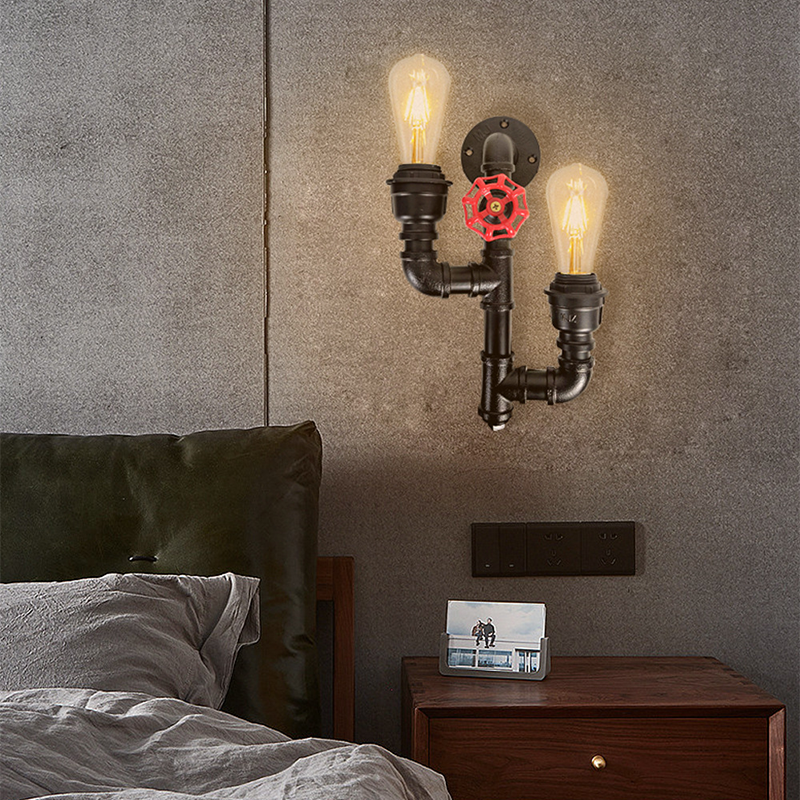Close-up view of the vintage industrial double head wall light showcasing its unique water pipe design and matte finish.