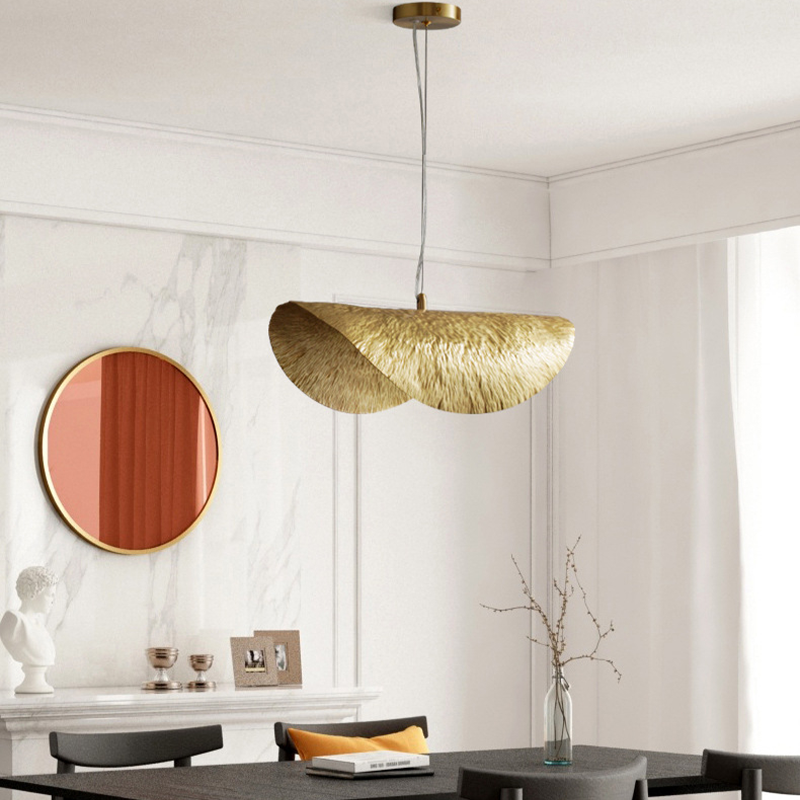 Elegant copper pendant light showcasing a lotus leaf design from an angle, perfect for dining rooms.