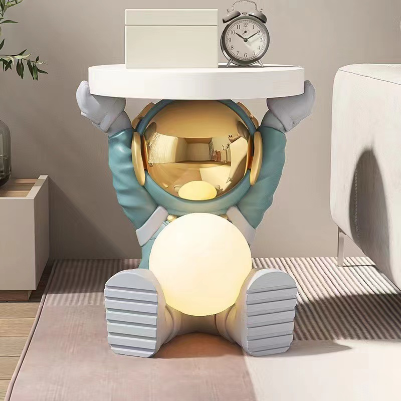 Close-up of the astronaut figurine holding the moon on the nightstand, highlighting unique design.