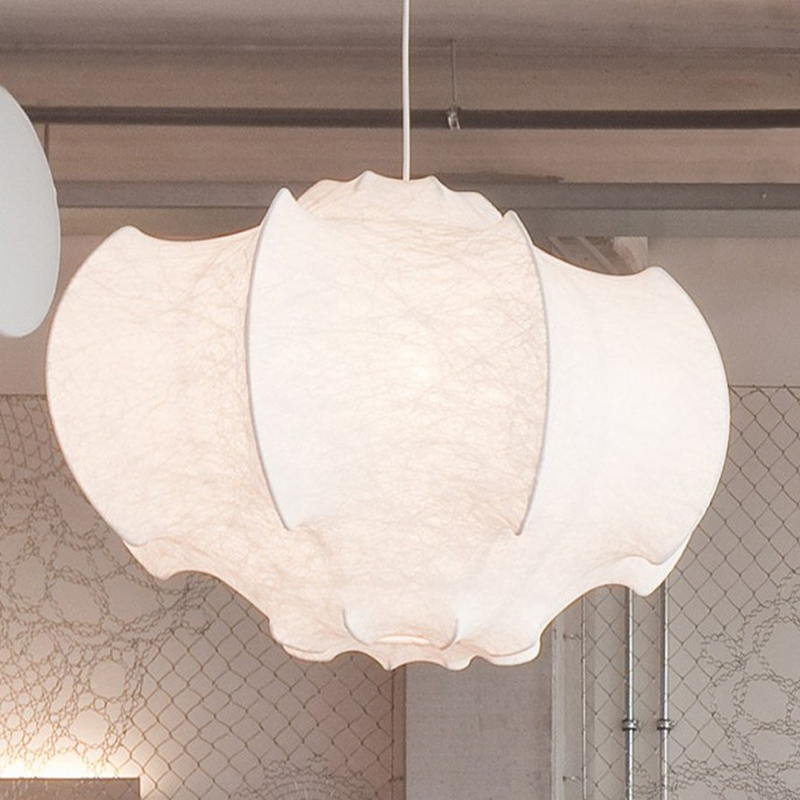 The Nordic silk lamp illuminating a stylish hotel lobby with its elegant glow.