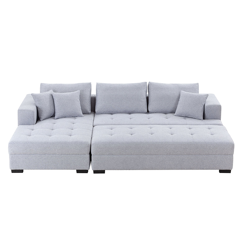 Stylish light grey sectional with ottoman, perfect for lounging