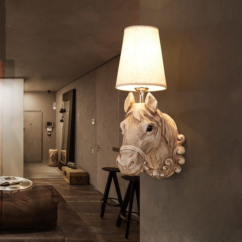 Close-up view of the Rustic Horse Resin Wall Lamp with intricate horse head detailing and fabric shade.